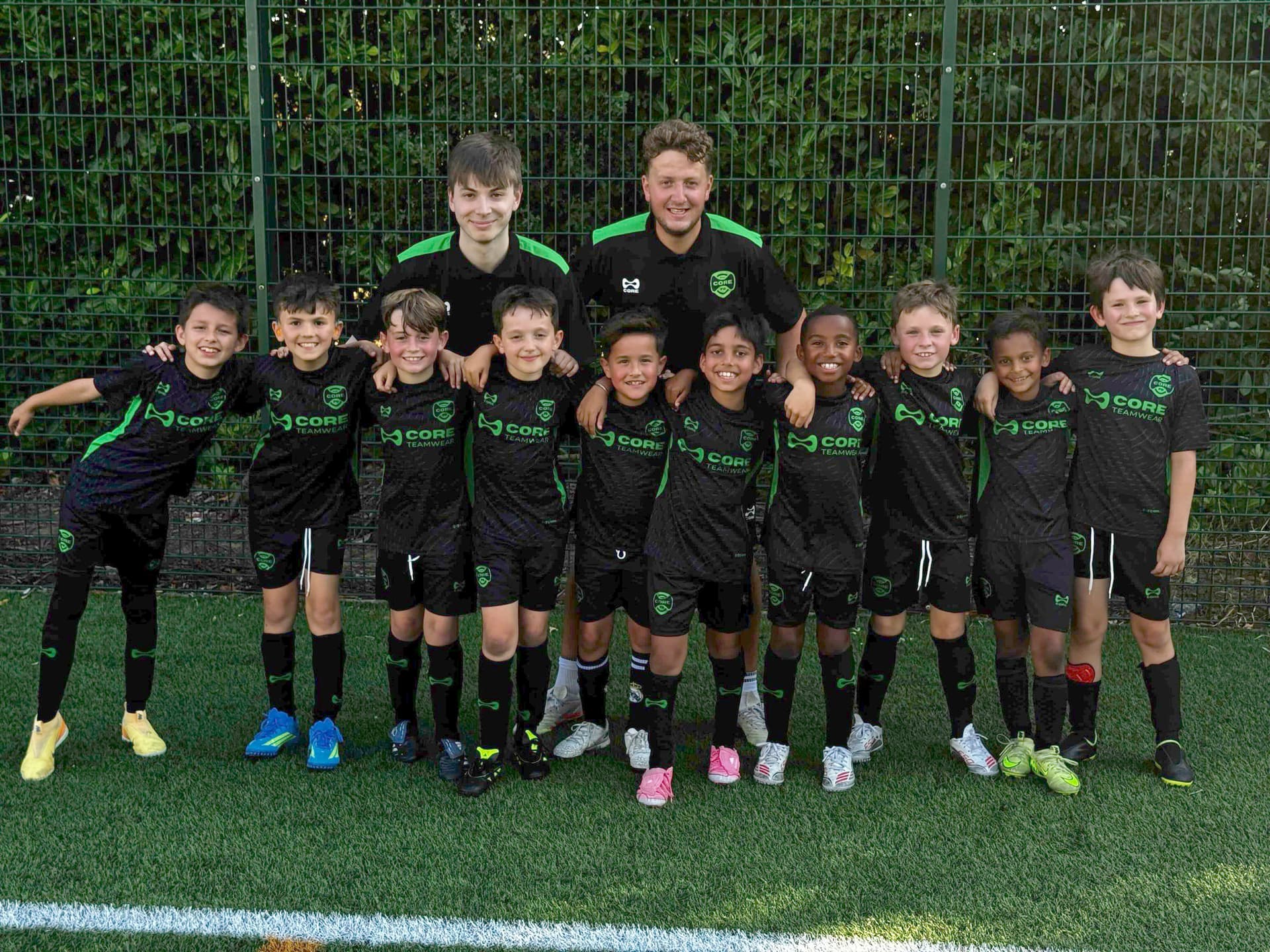 CORE FC squad with their coaches